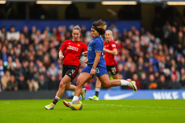 Le Tissier and Turner keep an eye on James as she attacks the Utd box.