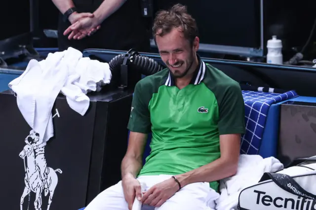 Daniil Medvedev smiles in his chair