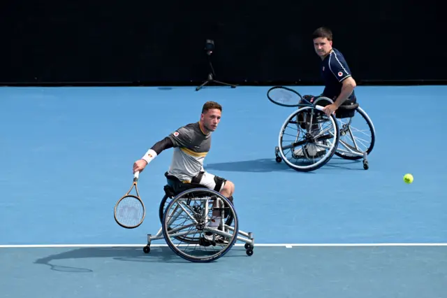 Alfie Hewett and Gordon Reid on court in their wheelchair doubles match