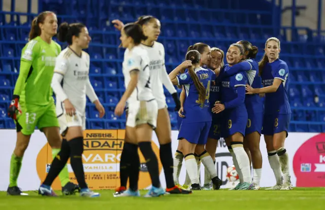 Chelsea celebrate their second goal v Madrid.