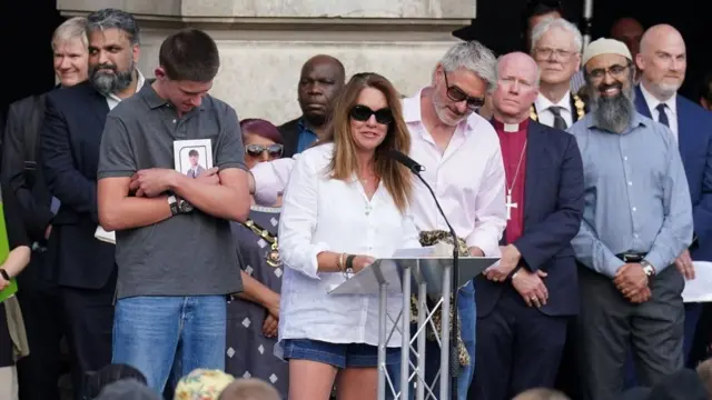 Emma Webber speaking at a vigil