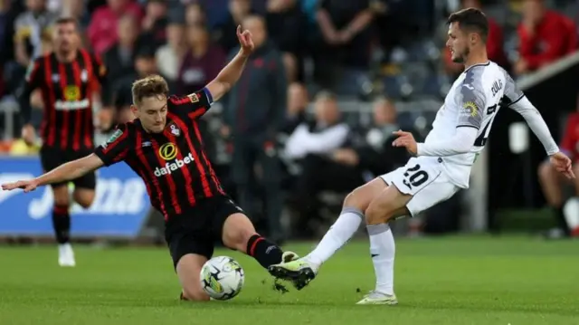 David Brooks (left) of Bournemouth challenges Liam Cullen of Swansea