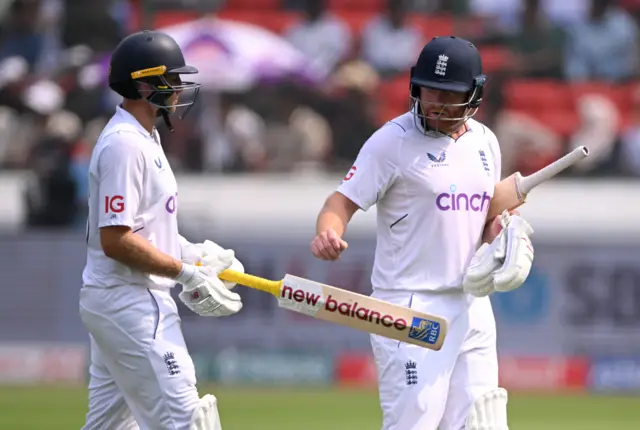 England's Joe Root and Jonny Bairstow walk off at lunch on day one of the first Test against India