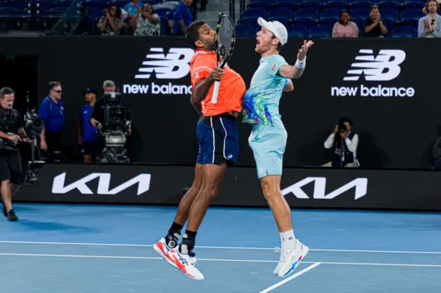 Rohan Bopanna and Matthew Ebden jump into a chest bump in celebration