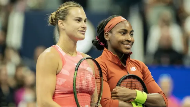 Aryna Sabakenka and Coco Gauff pose at the net for pre-match photos