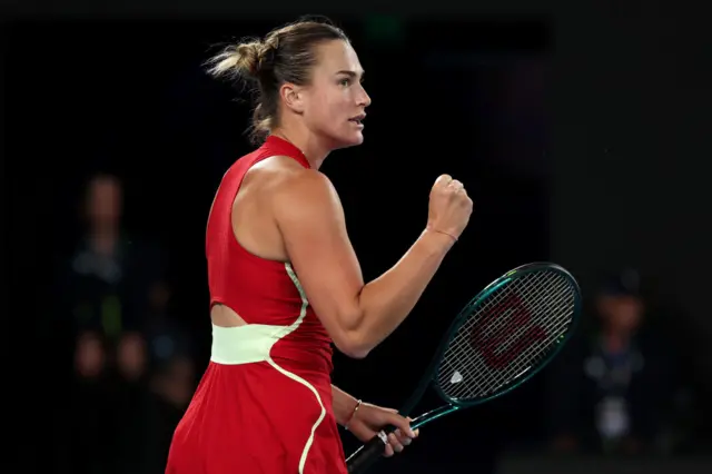 Aryna Sabalenka pumps her fist in celebration