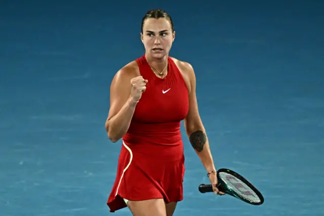 Aryna Sabalenka clenches her fist in celebration