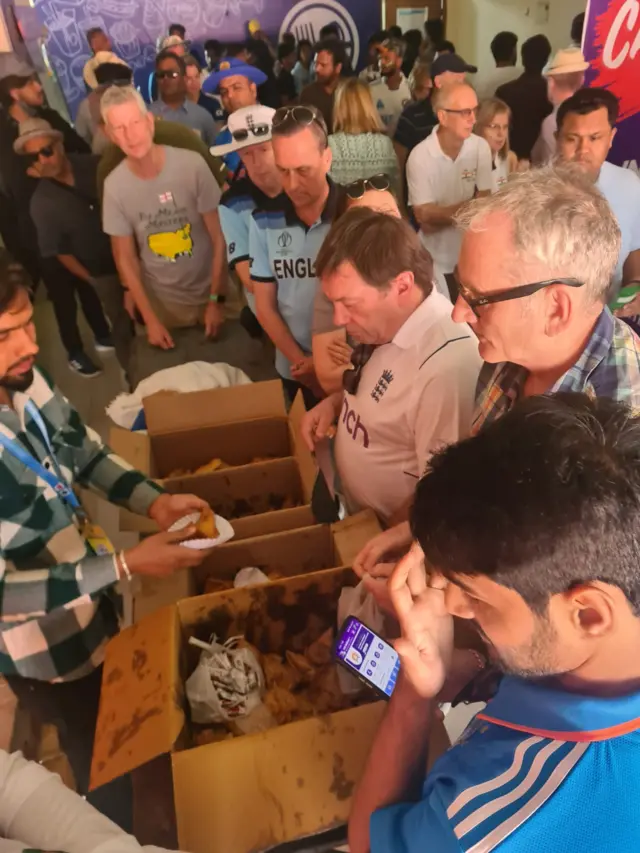 Fans at the India-England Test buy food during the lunch interval