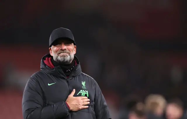 Jurgen Klopp puts his hand to his chest