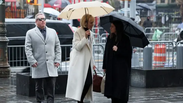 E. Jean Carroll walks outside the Manhattan Federal Court, for the second civil trial after she accused former U.S. President Donald Trump of raping her decades ago, in New York City, U.S., January 26, 2024.