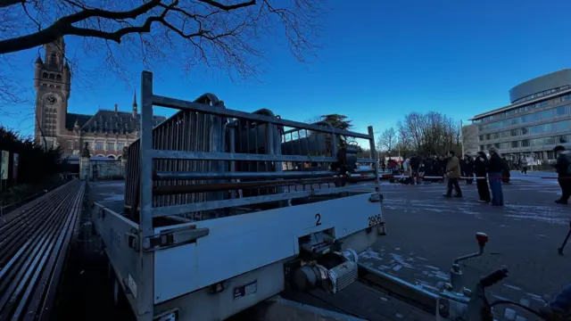 Barricades on truck with Peace Palace in the background