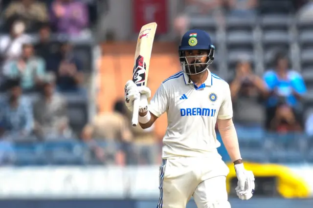 KL Rahul raising his bat after hitting a half-century