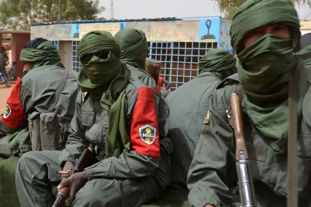 Malian army soldiers, pro-government militia members and former rebels, predominantly Tuaregs, take part in their first joint patrol in Gao in northern Mali on February 23, 2017.