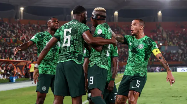 Nigeria celebrate a goal against Cameroon