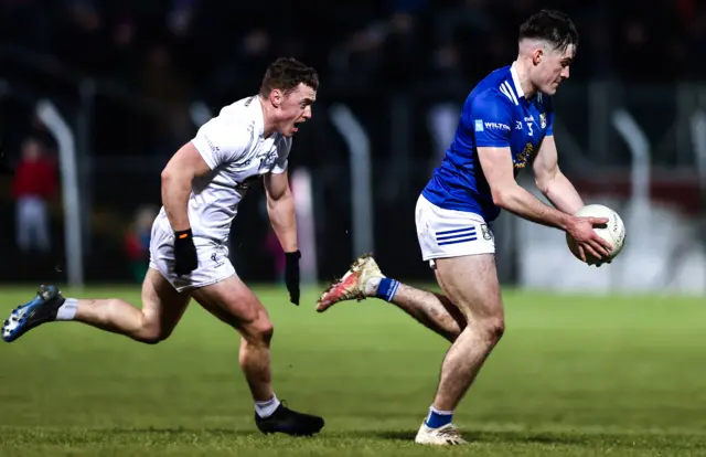 Oisin Kiernan speeds ahead of Kildare's Jimmy Hyland at Dr Cullen Park