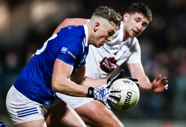 Cavan's Paddy Lynch attempts to burst away from Kildare's Shea Ryan at Dr Cullen Park