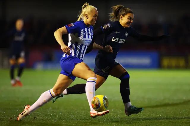 Maria Thorisdottir of Brighton & Hove Albion in action against her former side Chelsea