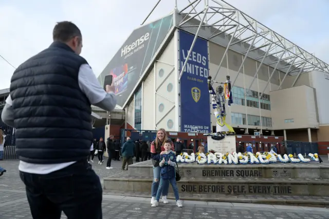 Elland Road - fans pose for a photo outside.