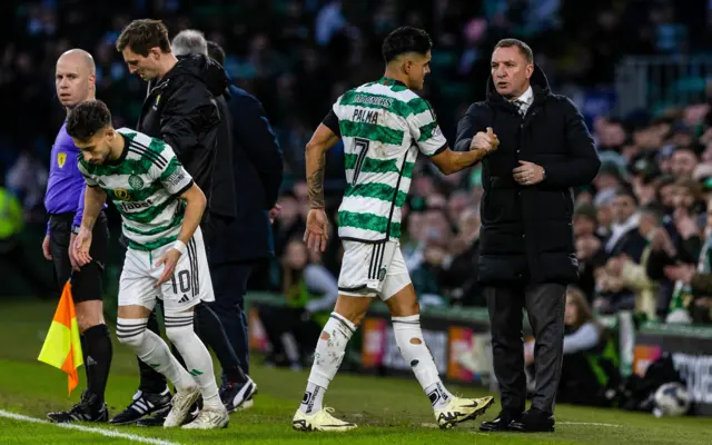 Luis Palma and Brendan Rodgers shake hands