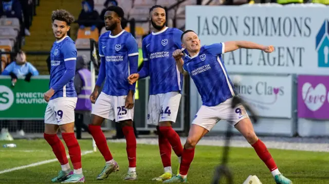 Portsmouth players celebrate a goal