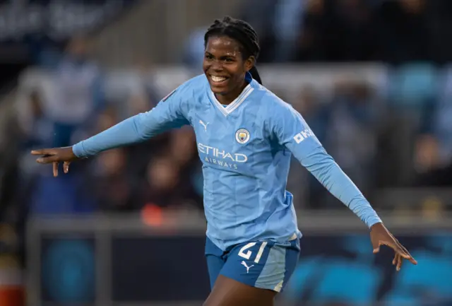 Khadija Shaw celebrates scoring against Tottenham in the WSL