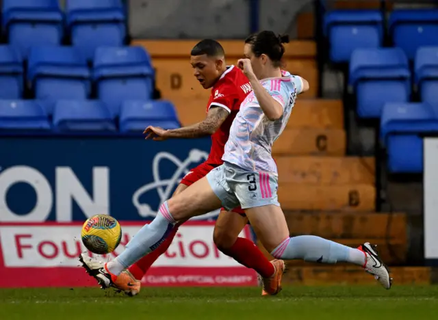 Van de Sanden looks to cross the ball into the box as Fox tries to block it.