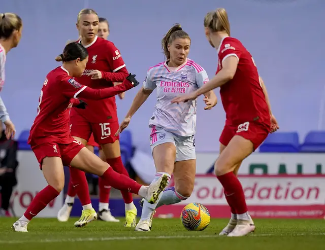 Pelova tries to dribble through a packed midfield.