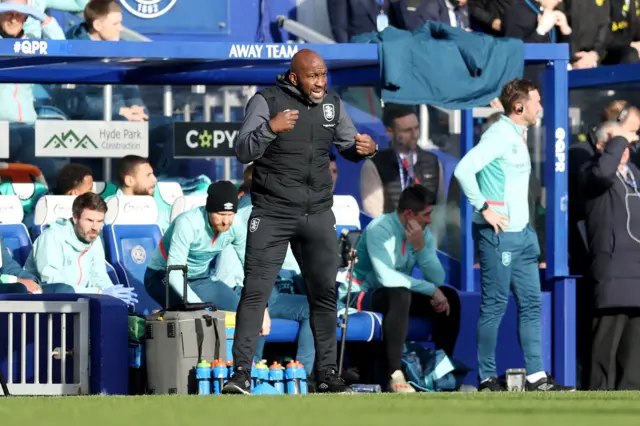 Huddersfield Town boss Darren Moore on the sidelines at QPR