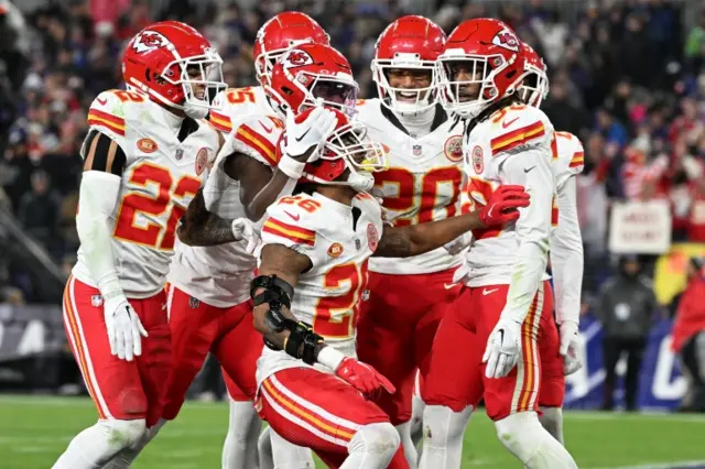 Kansas City Chiefs players celebrate an interception