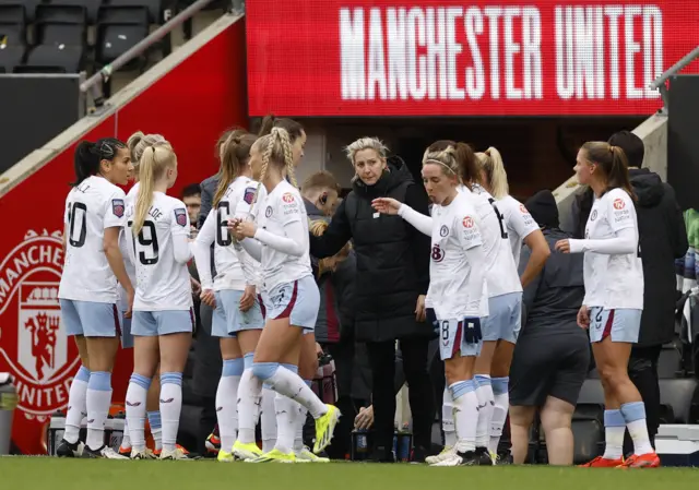 Carla Ward talks to her Villa side on the touchline.