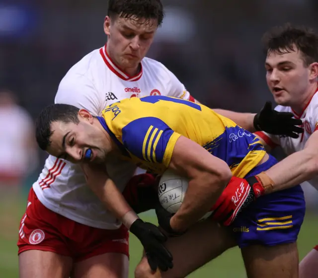 Tyrone's Tiaran Quinn and Michael McKernan challenge Roscommon's Ciaran Lennon