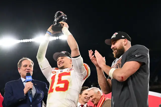 Patrick Mahomes lifts the Lamar Hunt trophy