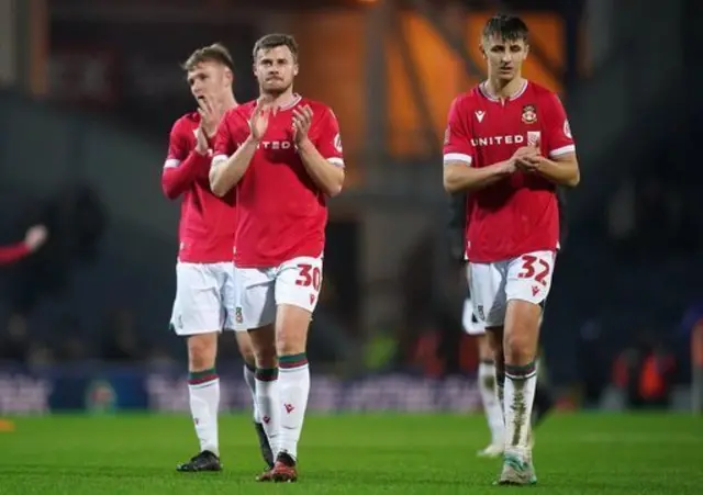 Wrexham players clap