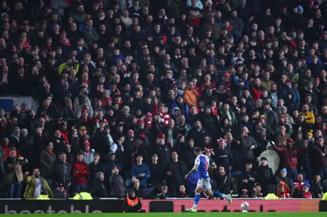 Szmodics celebrates in front of Wrexham fans