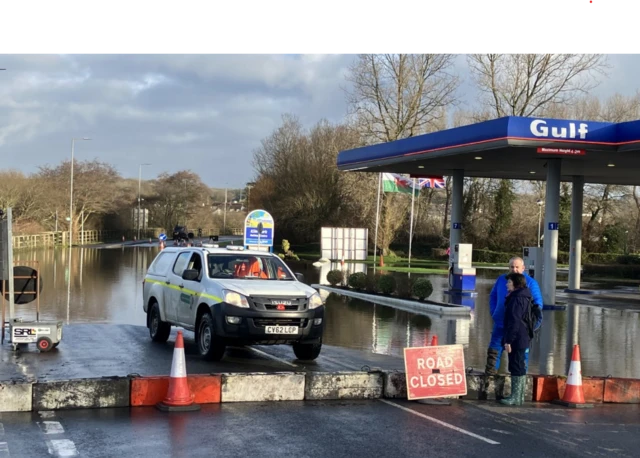 Flooding outside a Gulf petrol station in Tenby in Wales