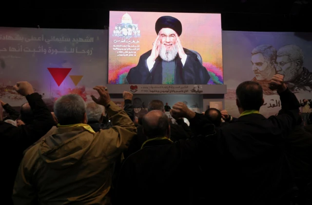 Lebanon's Hezbollah leader Sayyed Hassan Nasrallah addresses his supporters through a screen during a ceremony to mark the fourth anniversary of the killing of senior Iranian military commander General Qassem Soleimani in a U.S. attack