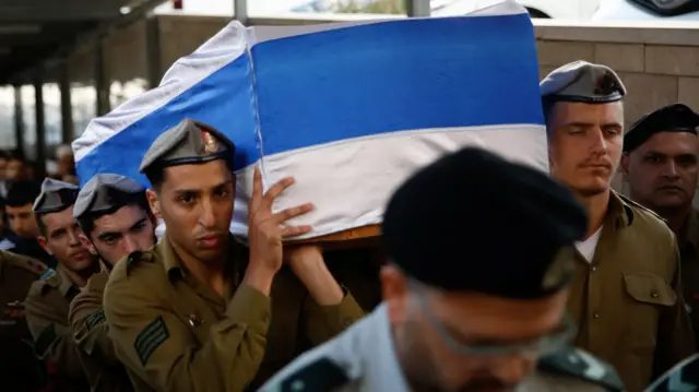 Israeli soldiers carry the casket of Israel's Druze minority Staff Sergeant Sufian Dagash, 21,