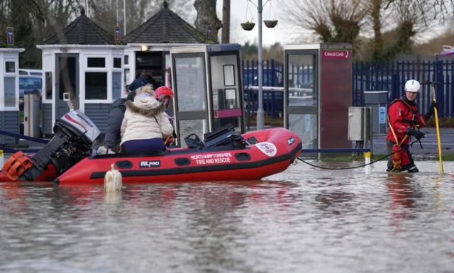 Northamptonshire Fire and rescue service rescue people from houseboats at the Billing Aquadrome in Northampton after the pathway to land was blocked due to rising water caused by Storm Henk