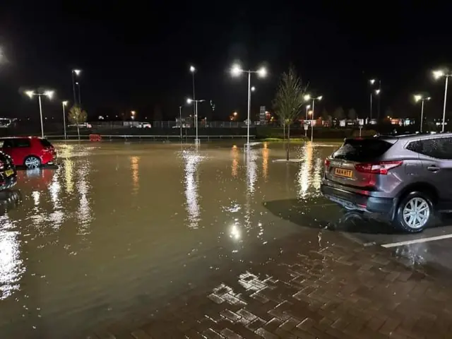 Cars on the flooded car park