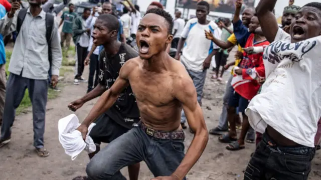 A supporter of opposition leader Martin Fayulu gestures during a demonstration in Kinshasa on December 27, 2023.