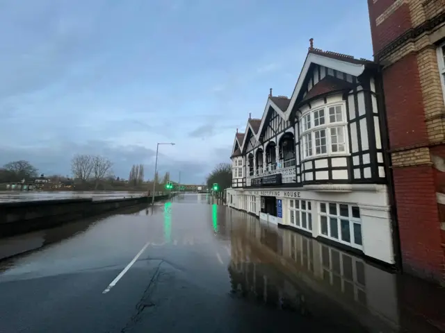 A flooded road in front of the restauant