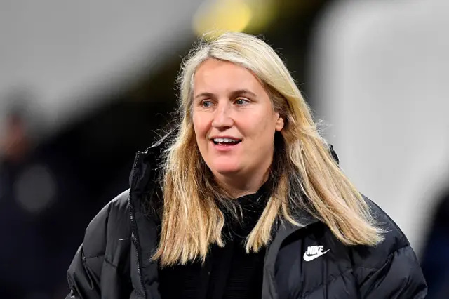 Emma Hayes smiles from the touchline