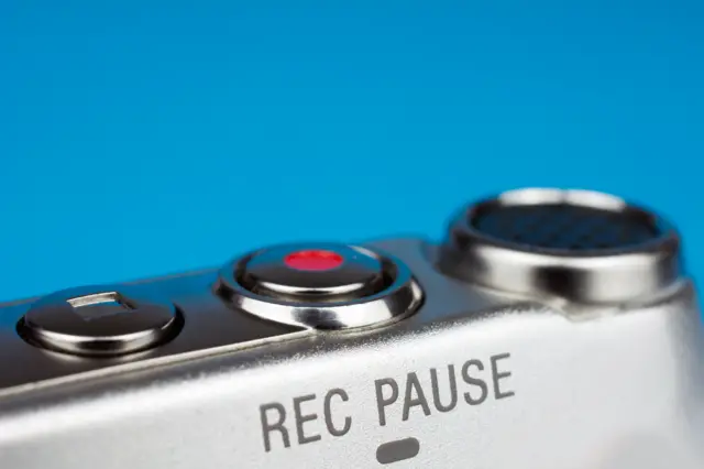 Dictaphone closeup of a red record button