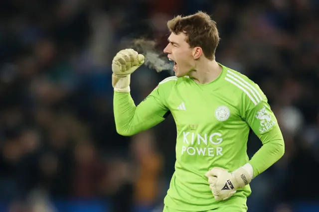 Leicester keeper Mads Hermandsen celebrates their early goal against Swansea