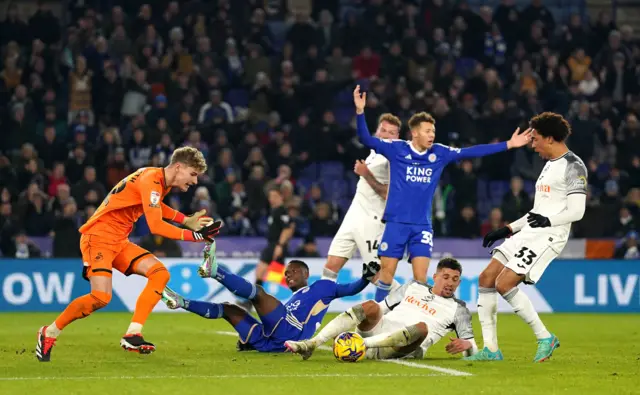 Swansea's Nathan Wood slides in to concede a penalty