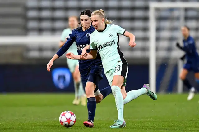 Aggie Beever-Jones of Chelsea runs with the ball whilst under pressure from Kaja Korosec