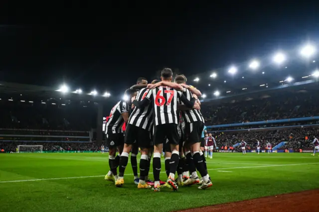 Newcastle players in a huddle