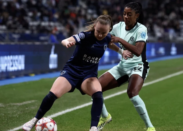 Julie Dufour in action with Chelsea's Ashley Lawrence