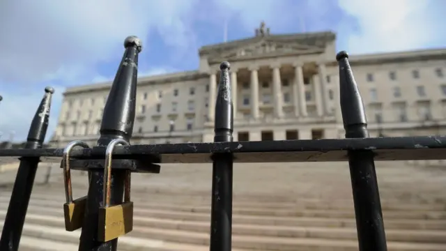 A padlocked gate in front of the Northern Ireland Assembly building at Stormont