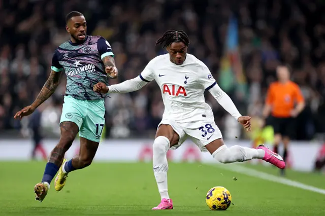 Destiny Udogie of Tottenham Hotspur battles for possession with Ivan Toney